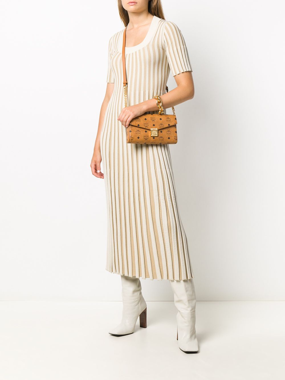 Brown bag carried by a person, showing the bag's fit