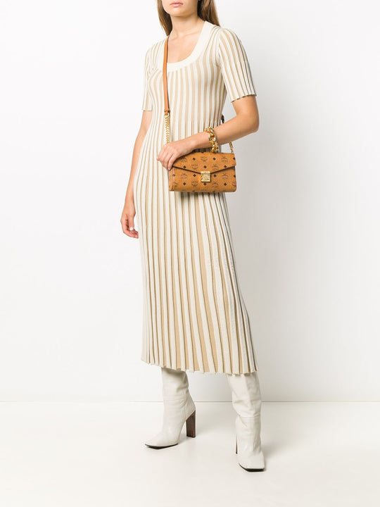 Brown bag carried by a person, showing the bag's fit