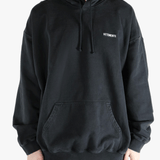 Black sweats-hoodies worn by a person, showing the fit