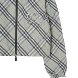 Close up of green jacket, showing texture of the pocket