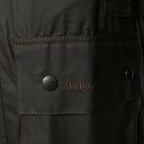 Close up of the brown jacket, showing texture of the cotton fabric