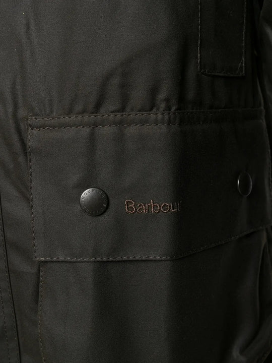 Close up of the brown jacket, showing texture of the cotton fabric