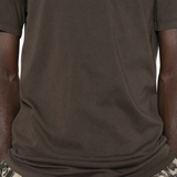 Close up of the brown t-shirt, showing texture of the cotton fabric