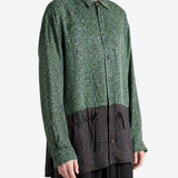Green shirt worn by a person, showing the shirt fit