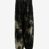 Black pants worn by a person, showing the pants fit