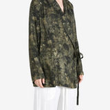 Green jacket worn by a person, showing the jacket fit
