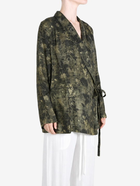 Green jacket worn by a person, showing the jacket fit