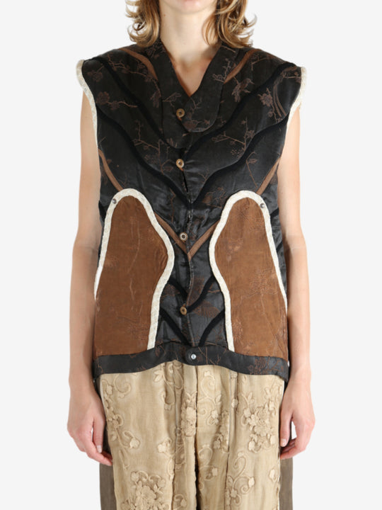 Black vest worn by a person, showing the vest fit