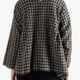 Navy shirt worn by a person, showing the shirt's fit