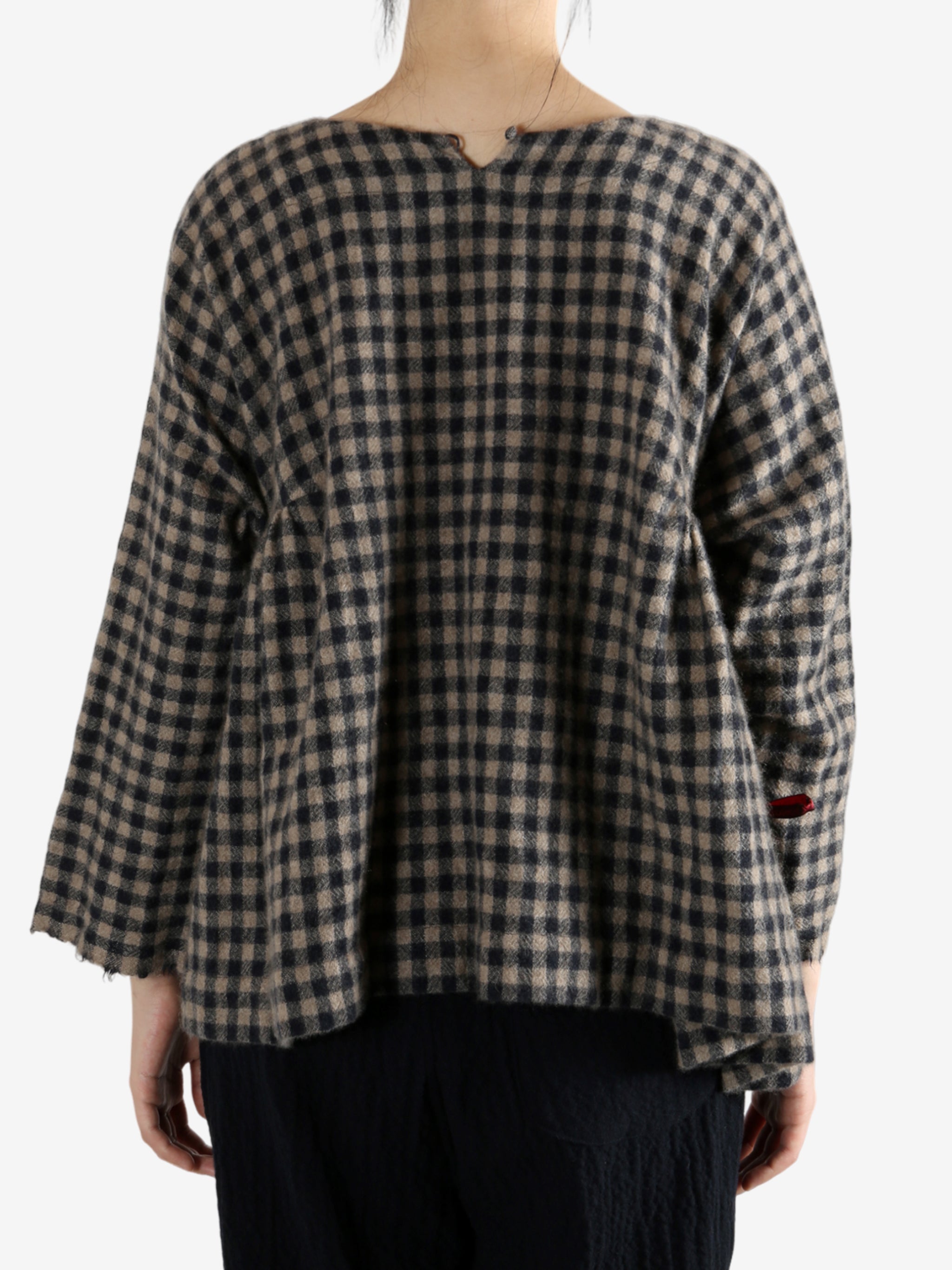 Navy shirt worn by a person, showing the shirt's fit