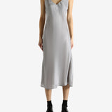 Grey dress worn by a person, showing the dress's fit