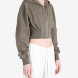 Brown hoodie worn by a person, showing the hoodie fit