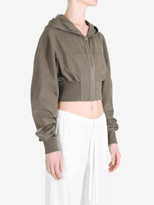 Brown hoodie worn by a person, showing the hoodie fit