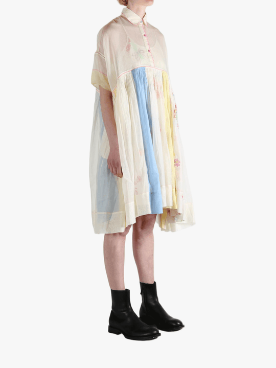 White dress worn by a person, showing the dress' fit