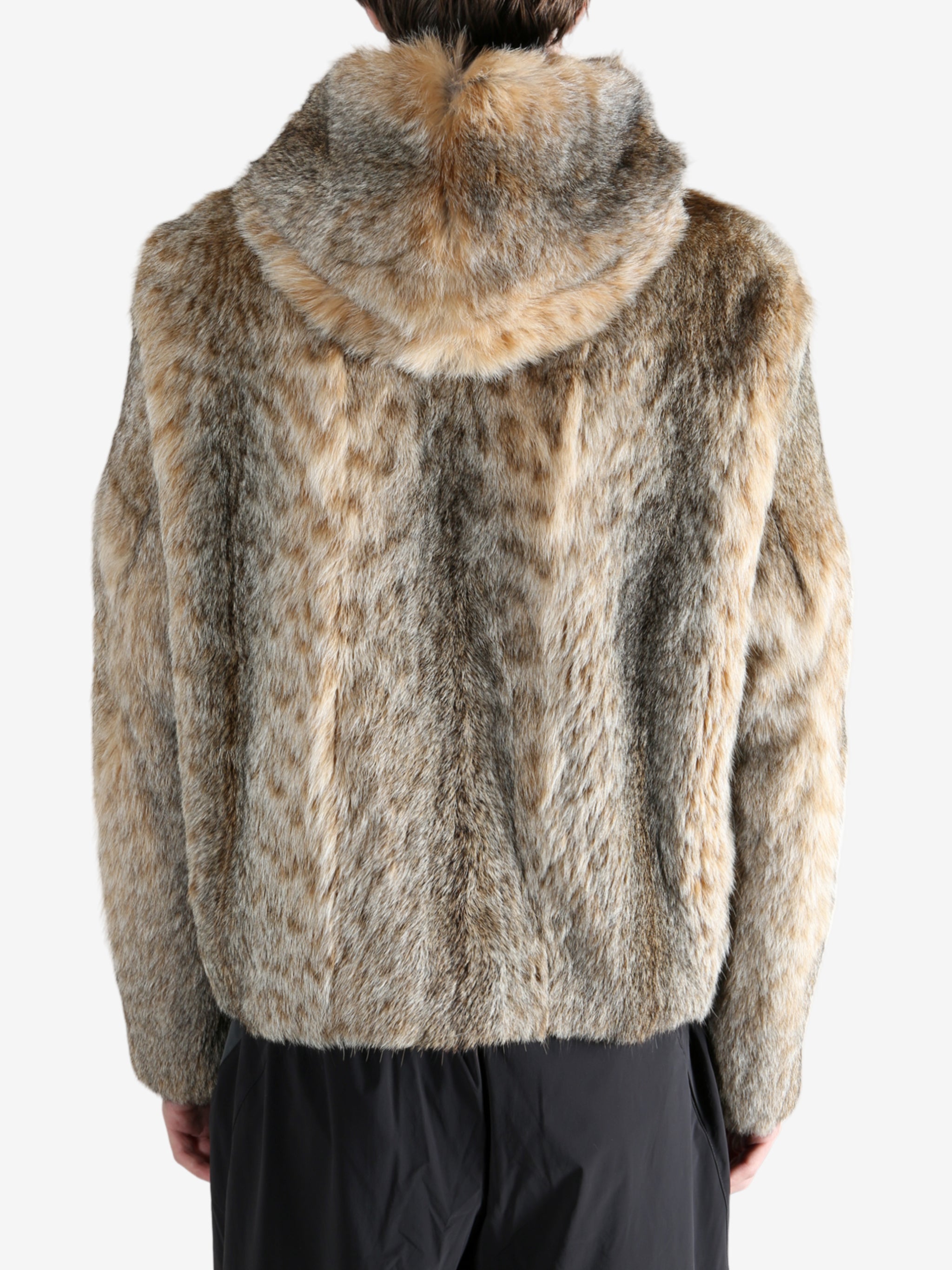 Tan jacket worn by a person, showing the jacket fit