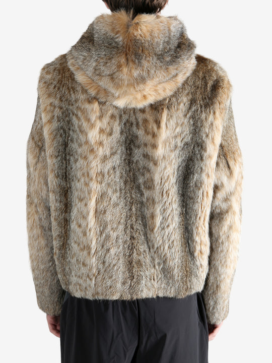 Tan jacket worn by a person, showing the jacket fit