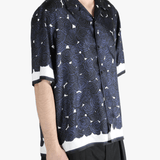 Blue shirt worn by a person, showing the shirt's fit