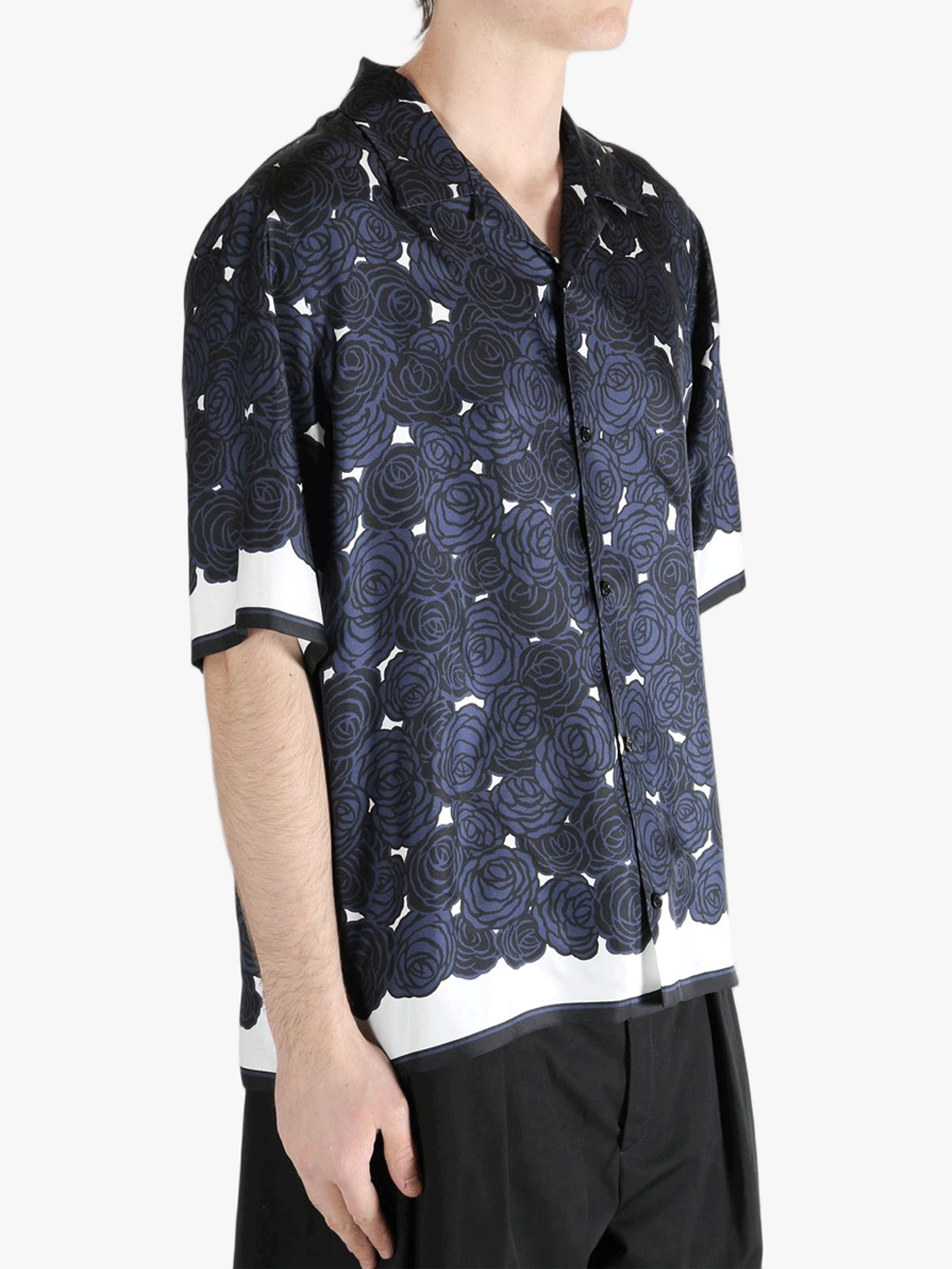 Blue shirt worn by a person, showing the shirt's fit