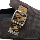 Close up of the blue mules, showing texture of the leather fabric