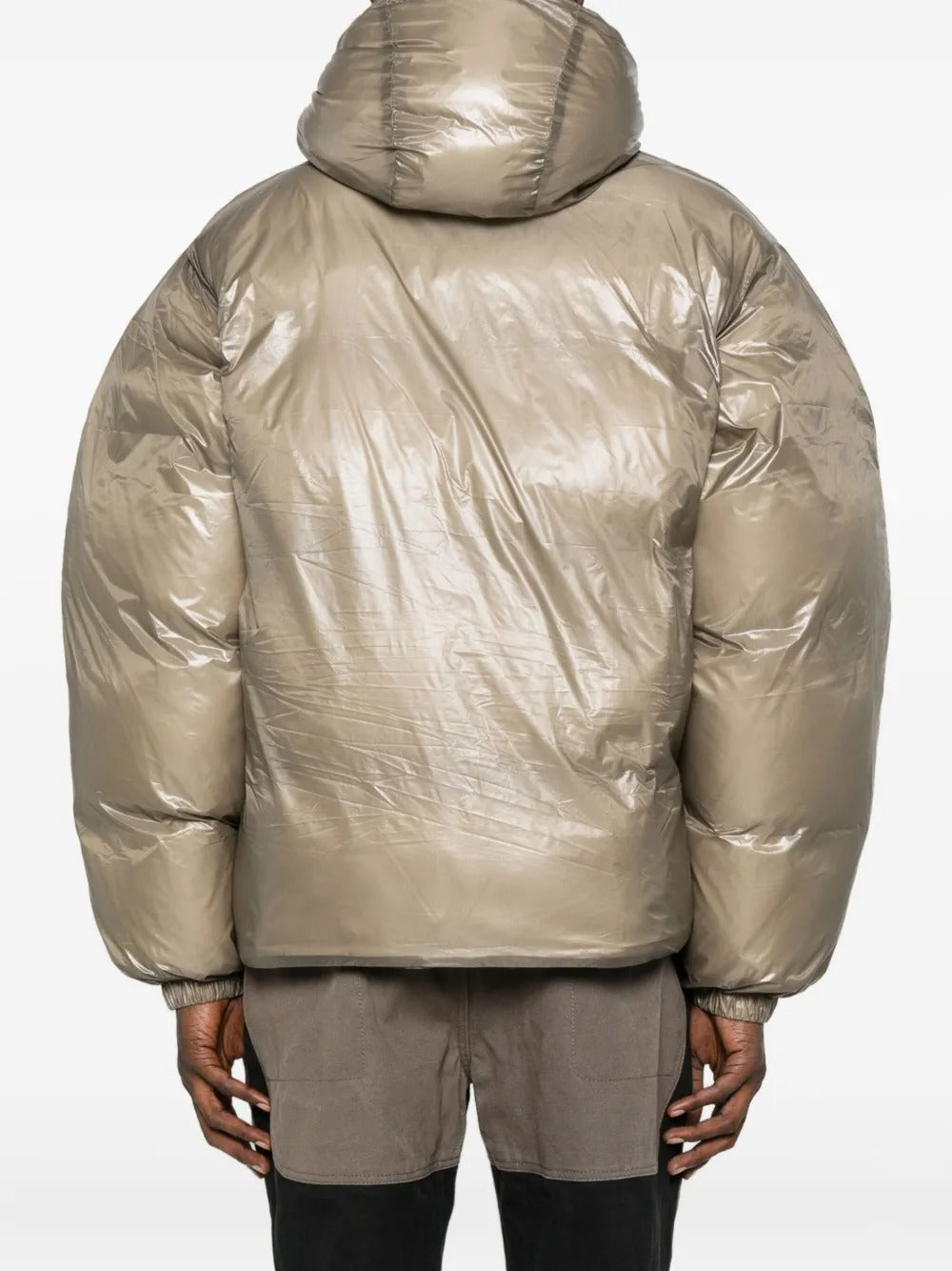 Tan jackets worn by a person, showing the jackets fit