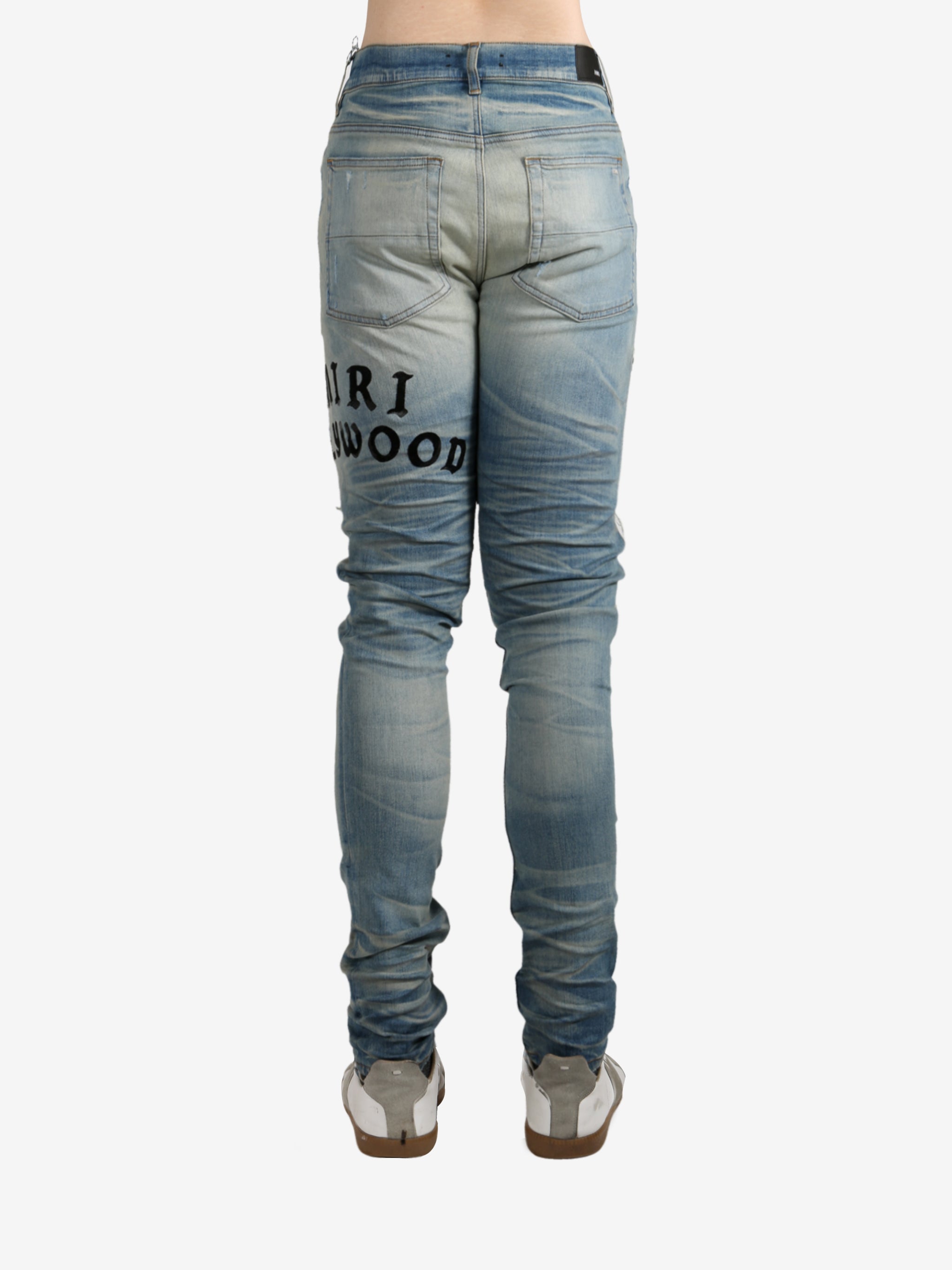 Blue pants worn by a person, showing the pants fit