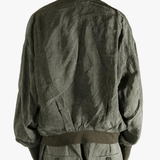 Green jackets worn by a person, showing the jackets fit