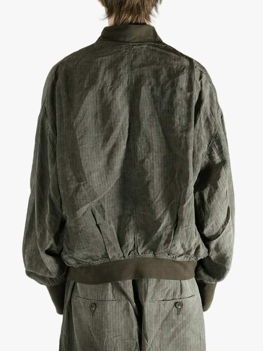 Green jackets worn by a person, showing the jackets fit