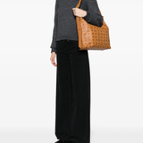 Brown bag worn by a person, showing the bag's fit