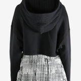 Black coats worn by a person, showing the coats fit