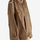 Brown shirt worn by a person, showing the shirt's fit