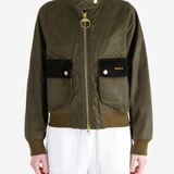 Green jacket worn by a person, showing the jacket fit