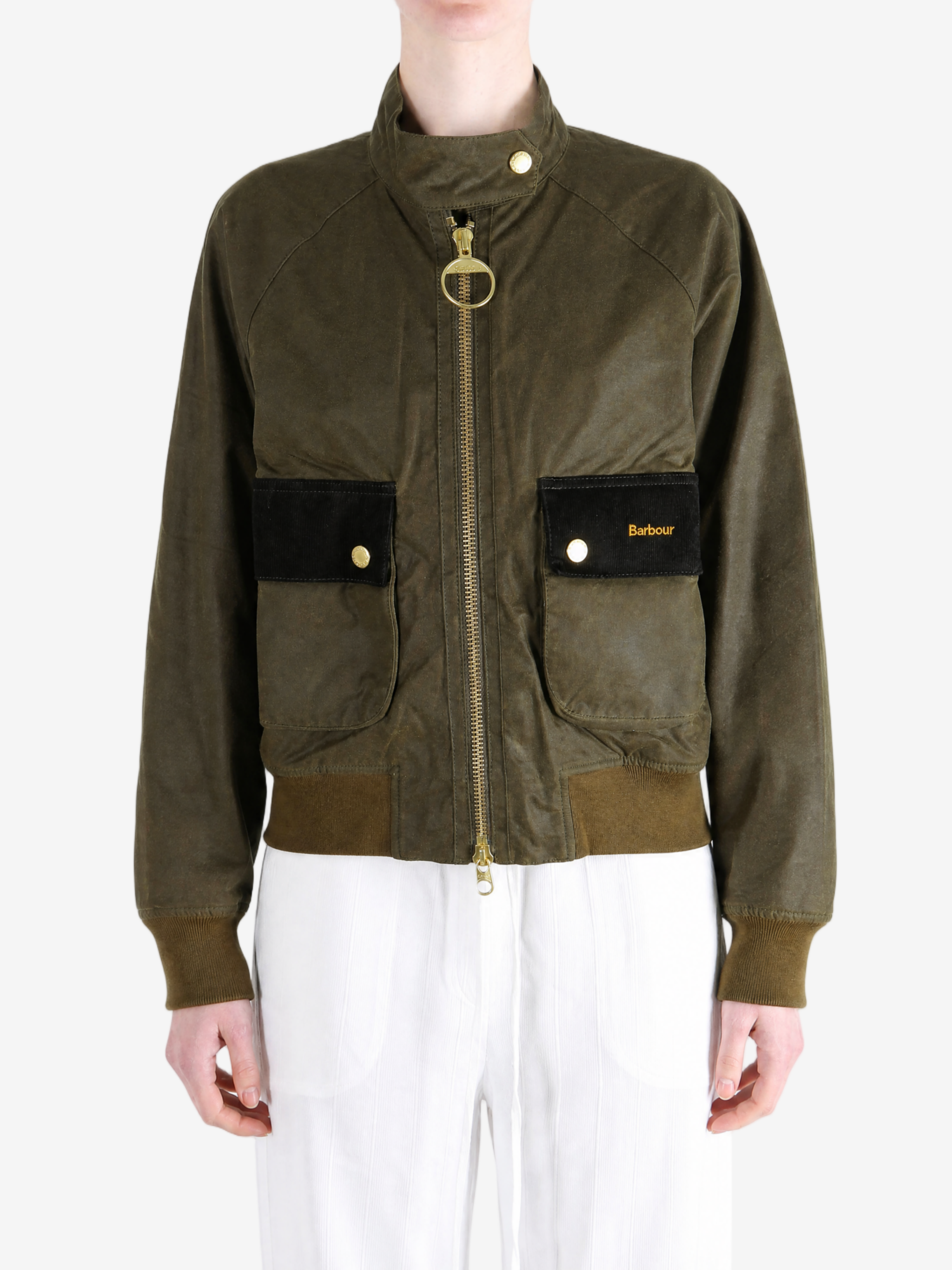 Green jacket worn by a person, showing the jacket fit