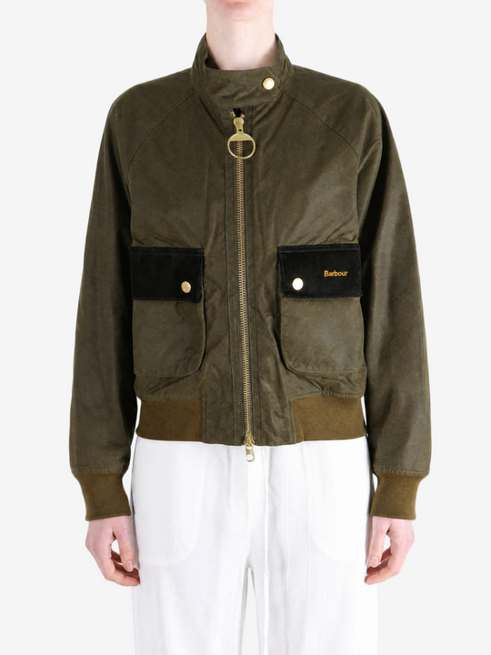 Green jacket worn by a person, showing the jacket fit