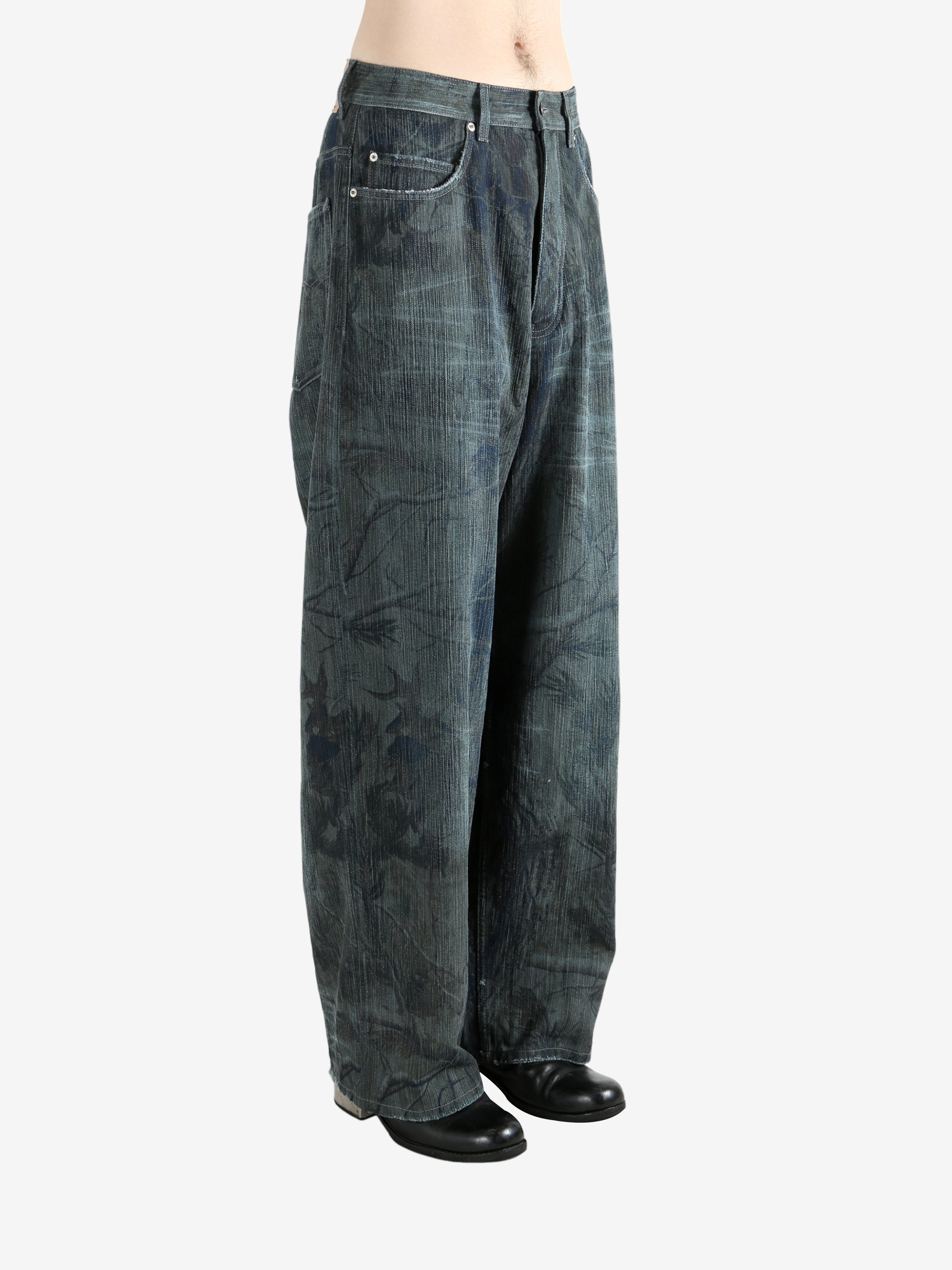 Blue jeans worn by a person, showing the jeans fit