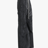 Black pants worn by a person, showing the pants's fit