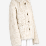 White jacket worn by a person, showing the jacket fit