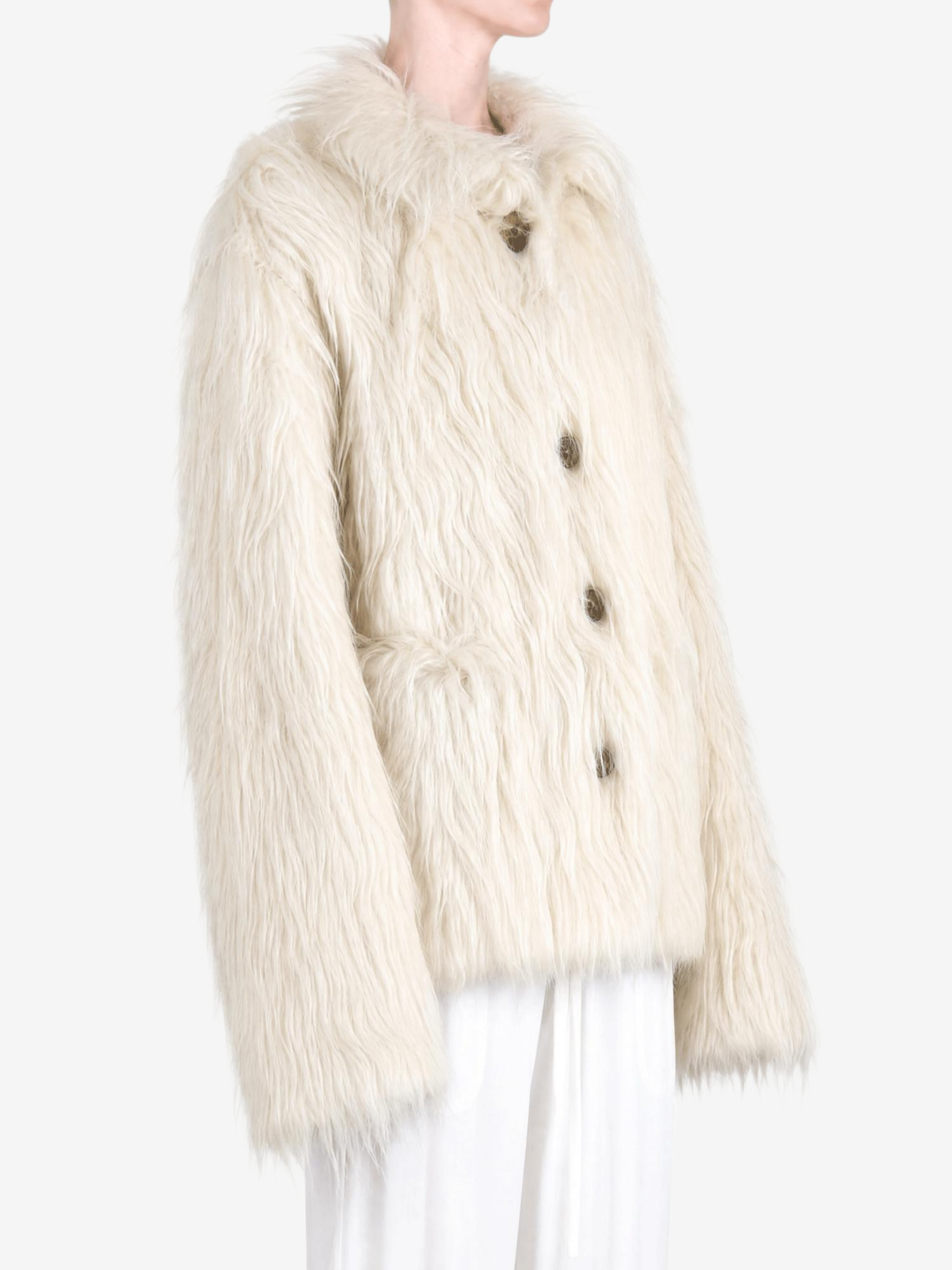 White jacket worn by a person, showing the jacket fit