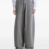 Grey pants worn by a person, showing the pants' fit