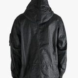 Black jacket worn by a person, showing the jacket fit