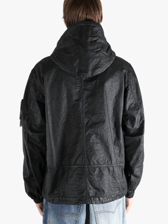 Black jacket worn by a person, showing the jacket fit