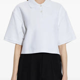 White t-shirt worn by a person, showing the t-shirt's fit