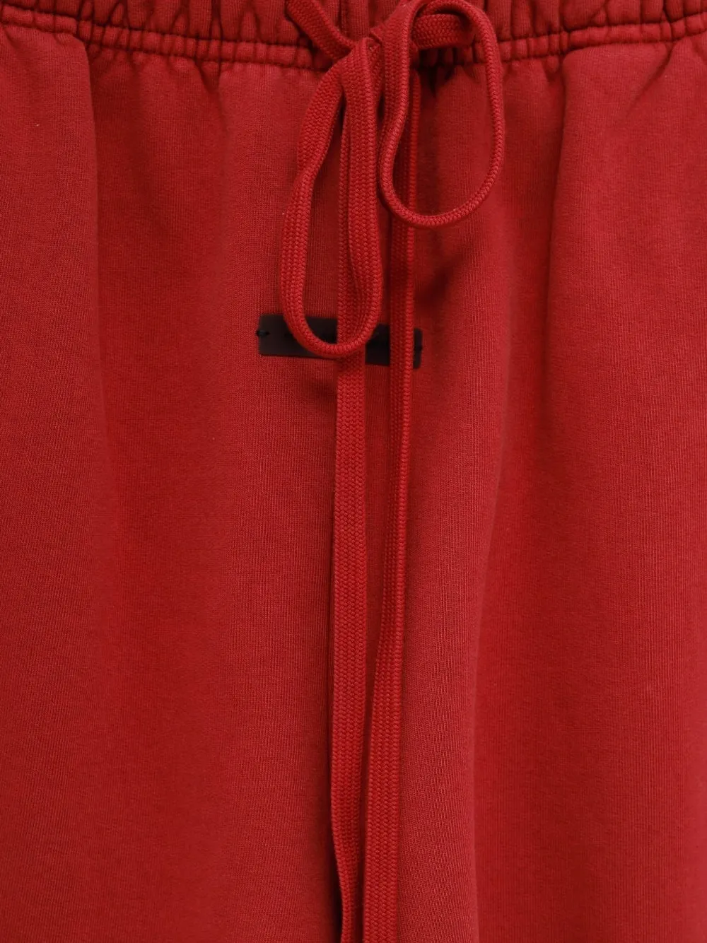 Close-up of red shorts,showing texture of the cotton fabric