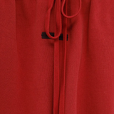Close-up of red shorts,showing texture of the cotton fabric