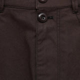 Close up of brown shorts, showing texture of the cotton fabric