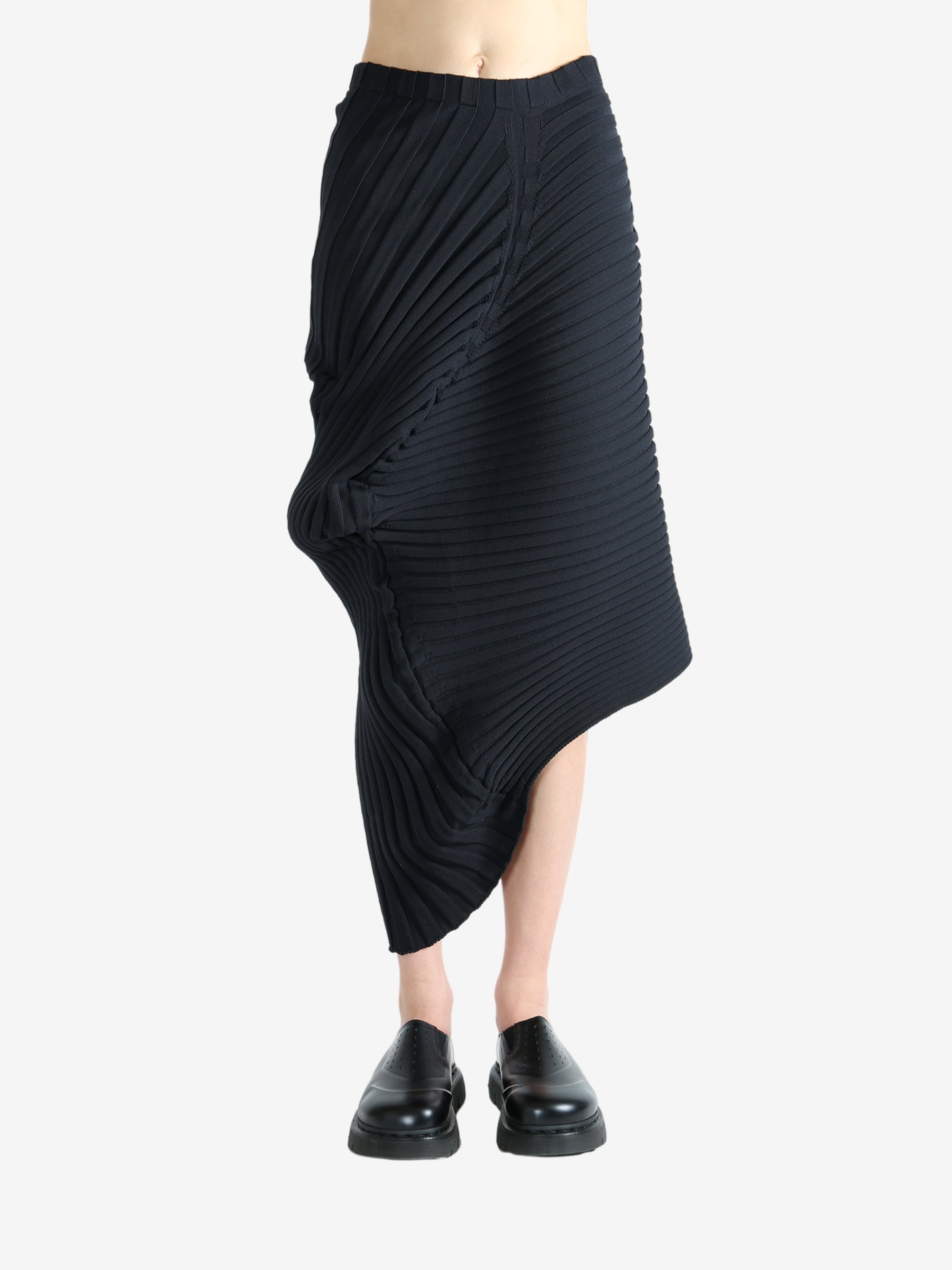 Black skirt worn by a person, showing the skirt fit