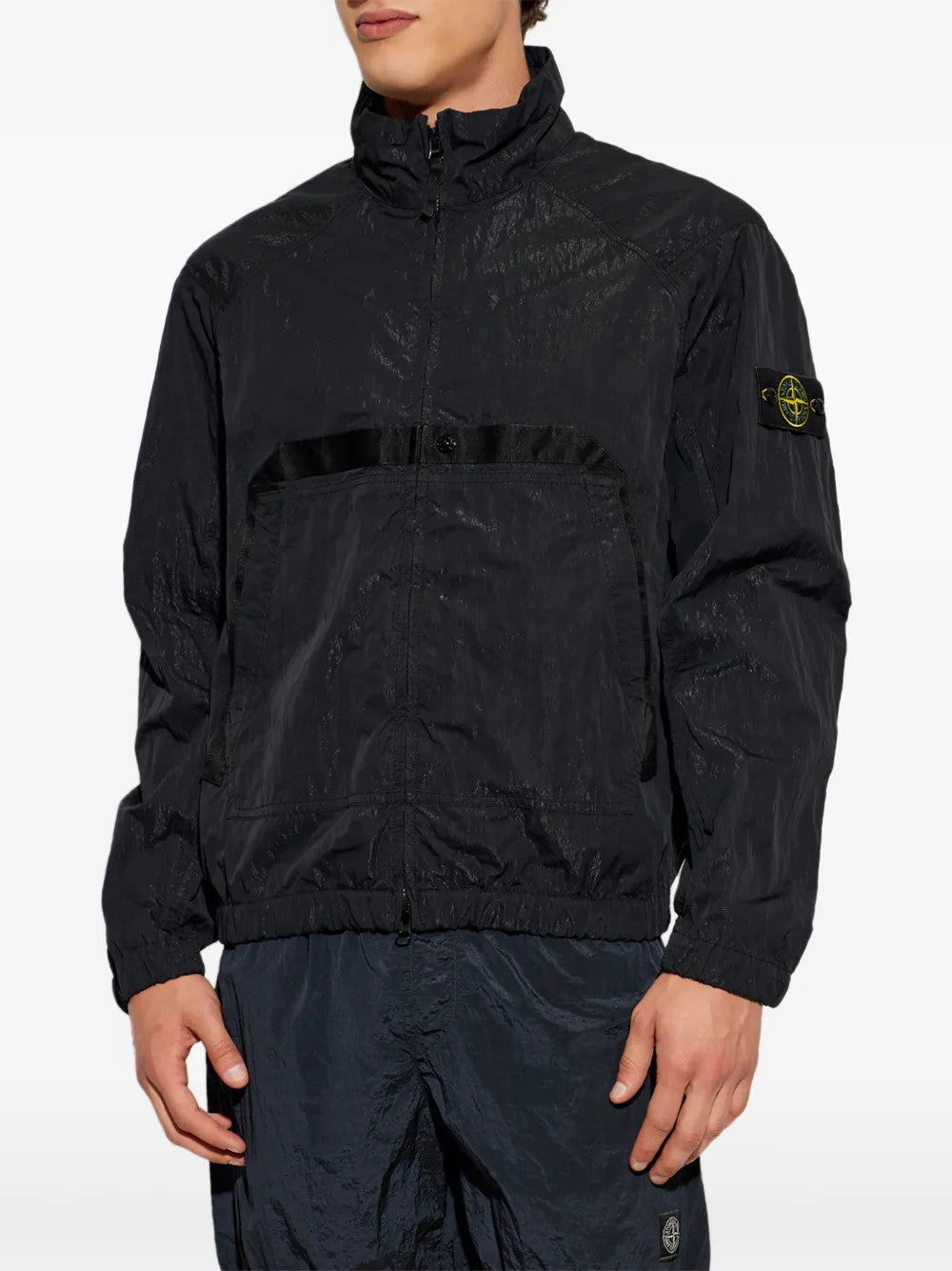 Black jacket worn by a person, showing the jacket fit