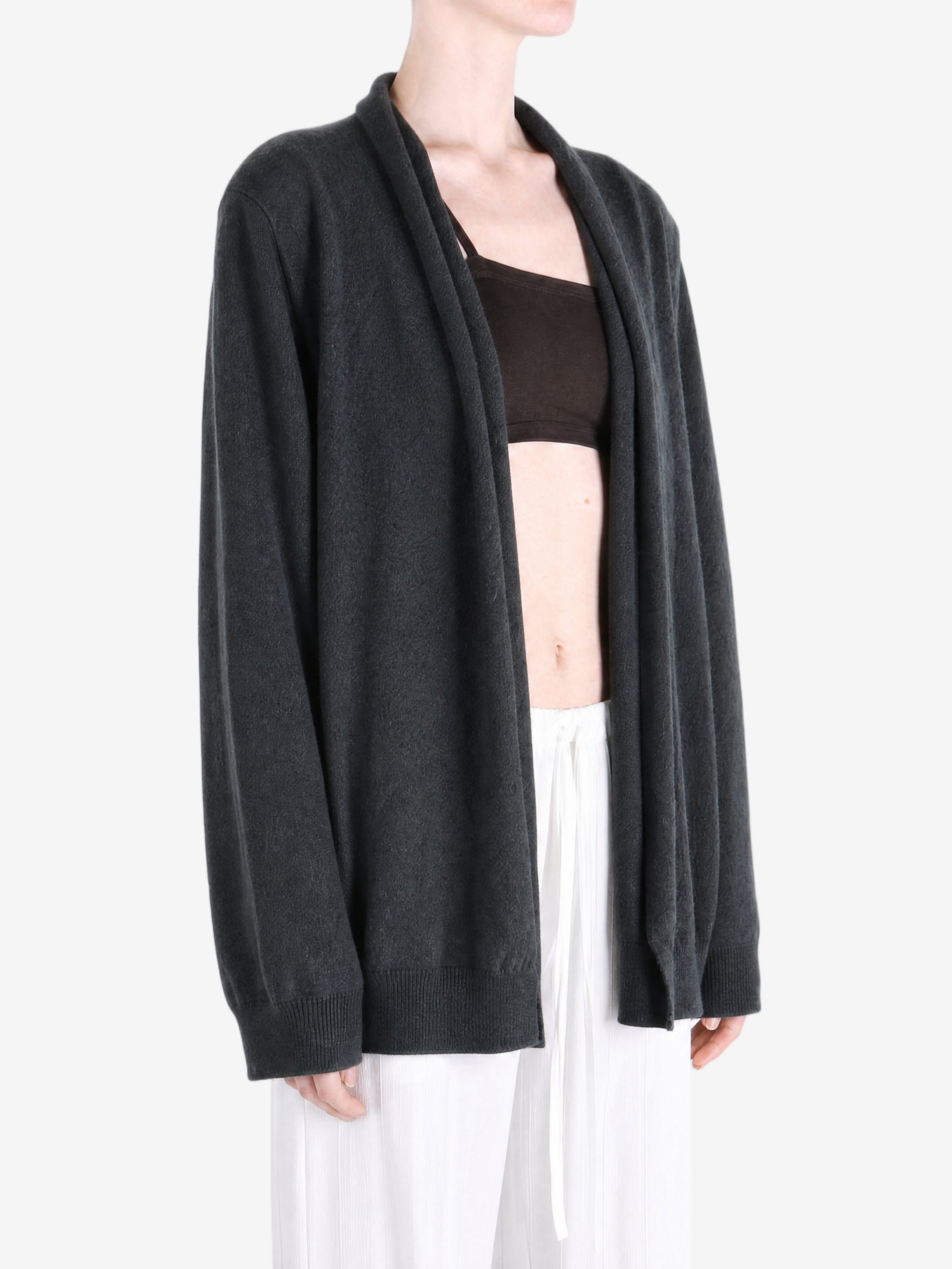 Grey knitwear worn by a person, showing the knitwear fit
