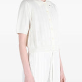 White shirt worn by a person, showing the shirt fit
