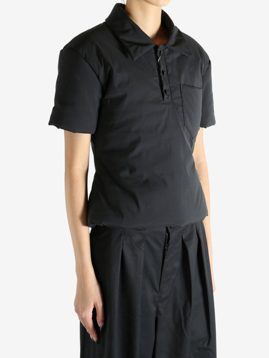 Black t-shirt worn by a person, showing the t-shirt's fit