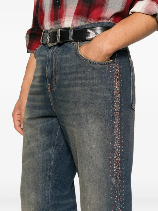 Blue jeans worn by a person, showing the jeans fit